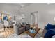 Spacious living area with hardwood floors, open layout, and a glimpse of the kitchen at 205 Town Creek Dr, Cary, NC 27519
