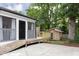 Backyard featuring a wood ramp, shed, and patio area, perfect for outdoor entertaining at 212 E Rockway St, Durham, NC 27704