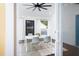 Enjoy outdoor dining on the covered patio with a ceiling fan and backyard views at 212 E Rockway St, Durham, NC 27704