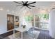 Relax on the covered patio with outdoor lighting, dining area, and access to the backyard at 212 E Rockway St, Durham, NC 27704