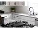 Bright kitchen with white cabinets, granite countertops, and subway tile backsplash blends style with function at 212 E Rockway St, Durham, NC 27704