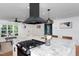 Modern kitchen design features white cabinets and a spacious island, perfect for both cooking and entertaining guests at 212 E Rockway St, Durham, NC 27704