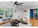 Cozy living room featuring white walls, hardwood floors, and stylish furnishings; blends comfort and classic design at 212 E Rockway St, Durham, NC 27704