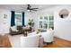 Cozy living room with hardwood floors, bright windows, and modern decor accents at 212 E Rockway St, Durham, NC 27704