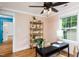 Bright office with hardwood floors, stylish furnishings, and a large window offering lots of natural light at 212 E Rockway St, Durham, NC 27704