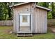 Shed exterior features rustic wood, string lights, and an open doorway at 212 E Rockway St, Durham, NC 27704