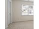 Empty bedroom featuring plush carpeting and an abundance of natural light through the windows at 216 Lewey Brook Dr, Cary, NC 27519