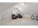 Bright bonus room with comfortable seating and a play area for  at 216 Lewey Brook Dr, Cary, NC 27519