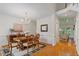 Elegant dining room featuring hardwood floors, a chandelier, and a view into the living room at 216 Lewey Brook Dr, Cary, NC 27519