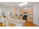Open kitchen featuring a breakfast bar and natural wood cabinetry at 216 Lewey Brook Dr, Cary, NC 27519