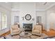 Comfortable living room area with fireplace and natural lighting at 216 Lewey Brook Dr, Cary, NC 27519