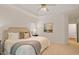 Spacious main bedroom with plush carpeting and large window at 216 Lewey Brook Dr, Cary, NC 27519