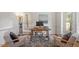 Well-lit office with hardwood floors and modern chairs and decor at 216 Lewey Brook Dr, Cary, NC 27519