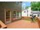 Spacious wooden patio with outdoor access, perfect for entertaining and enjoying the backyard at 216 Lewey Brook Dr, Cary, NC 27519