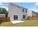Backyard view with patio, privacy fence, lush grass and new construction at 2208 Seneca Dr, Raleigh, NC 27604