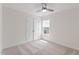 Bedroom featuring neutral carpet, a double door closet, and a window with blinds at 2208 Seneca Dr, Raleigh, NC 27604