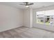 Bedroom with neutral carpet, ceiling fan, window with blinds, and white walls at 2208 Seneca Dr, Raleigh, NC 27604