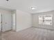 Bedroom with neutral carpet, a window, and a white door leading into another room at 2208 Seneca Dr, Raleigh, NC 27604