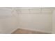 Walk-in closet with neutral carpet, white walls, and wire shelving at 2208 Seneca Dr, Raleigh, NC 27604