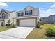 Beautifully landscaped two-story home with a two-car garage and well-maintained front lawn at 2208 Seneca Dr, Raleigh, NC 27604