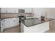 Kitchen featuring white cabinets, stainless steel appliances, granite countertops, and an island with sink at 2208 Seneca Dr, Raleigh, NC 27604