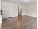 Spacious living area with hardwood floors, neutral paint, and ample natural light at 2208 Seneca Dr, Raleigh, NC 27604
