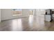 Bright living area with hardwood floors, windows, and easy access to the kitchen and patio at 2208 Seneca Dr, Raleigh, NC 27604