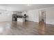 Open-concept living area with hardwood floors, stainless steel appliances, and kitchen island at 2208 Seneca Dr, Raleigh, NC 27604