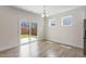 Bright living area with wood floors, a sliding glass door, and windows offering plenty of natural light at 2208 Seneca Dr, Raleigh, NC 27604