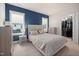 This primary bedroom features a walk-in closet, a tufted headboard, and stylish furnishings at 224 Daniel Ridge Rd, Wendell, NC 27591