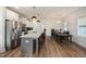 Bright kitchen featuring stainless steel appliances, a large island with seating, and an adjacent dining area at 224 Daniel Ridge Rd, Wendell, NC 27591