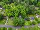 Overhead view of the property situated among mature trees, providing a sense of privacy and natural beauty at 2324 Stevens Rd, Raleigh, NC 27610