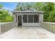Multi-level backyard deck, adjoining a screened porch, ideal for outdoor enjoyment at 2324 Stevens Rd, Raleigh, NC 27610