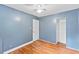 Calm bedroom with hardwood floors, neutral paint and closet at 2324 Stevens Rd, Raleigh, NC 27610