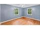Comfortable bedroom featuring hardwood floors, a ceiling fan and natural light at 2324 Stevens Rd, Raleigh, NC 27610