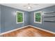 Inviting bedroom with hardwood floors, natural light, and modern shelving at 2324 Stevens Rd, Raleigh, NC 27610