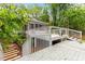 View of the spacious home deck featuring white railings and decorative flooring, providing an inviting outdoor space at 2324 Stevens Rd, Raleigh, NC 27610