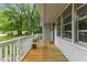 Covered front porch with wood flooring and charming curb appeal at 2324 Stevens Rd, Raleigh, NC 27610