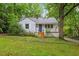 Lovely single-story home featuring a welcoming entrance and lush green lawn at 2324 Stevens Rd, Raleigh, NC 27610