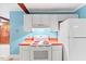 Bright kitchen featuring white cabinetry and an electric oven at 2324 Stevens Rd, Raleigh, NC 27610