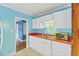 Cozy kitchen with white cabinets, dishwasher, and eat-in space at 2324 Stevens Rd, Raleigh, NC 27610