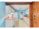An eat-in kitchen features white cabinetry, appliances, and traditional finishes at 2324 Stevens Rd, Raleigh, NC 27610