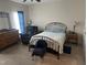 Comfortable bedroom with natural light, neutral paint, and plush carpet at 2436 Nc 97, Zebulon, NC 27597