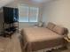 Bedroom with carpet flooring, a window with blinds, and a mounted TV at 2436 Nc 97, Zebulon, NC 27597