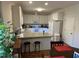 Bright kitchen featuring white cabinets, granite countertops, and modern appliances at 2436 Nc 97, Zebulon, NC 27597