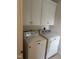 Laundry area with a side by side washer and dryer and upper cabinets at 2436 Nc 97, Zebulon, NC 27597