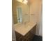 Bathroom vanity featuring modern faucet, white countertop, and wood cabinetry at 2577 Silas Peak Ln, Apex, NC 27523