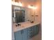 This luxurious bathroom features double sinks, shaker cabinets, and a glass shower at 2577 Silas Peak Ln, Apex, NC 27523