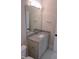 This bathroom vanity features modern fixtures, drawers, and a large mirror for a contemporary look at 2577 Silas Peak Ln, Apex, NC 27523