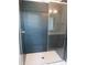 Bathroom shower features gray subway tile surround and glass door at 2577 Silas Peak Ln, Apex, NC 27523